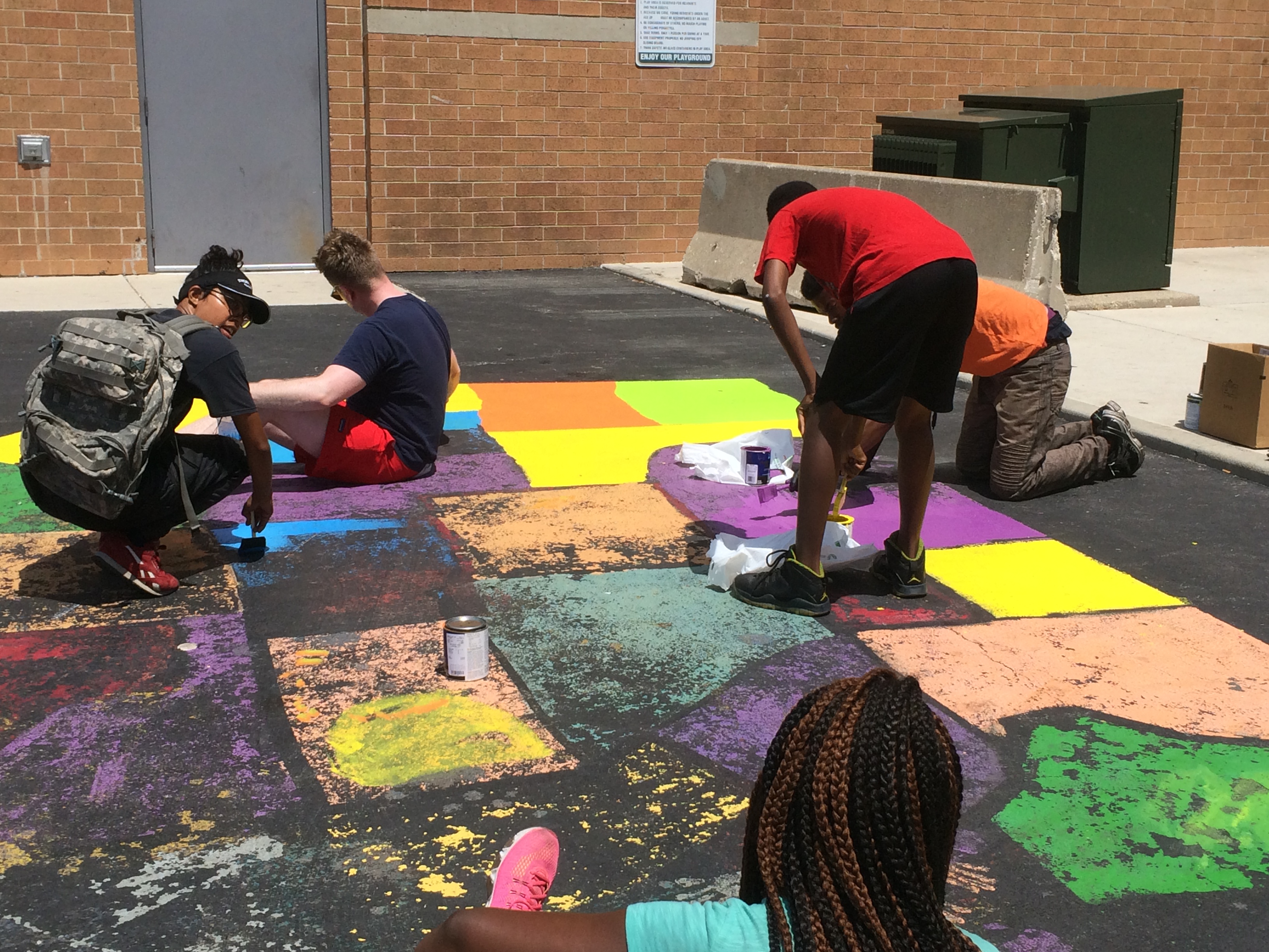  - Helping community residents at The Community Builders Inc - Oakley Square Apartments repaint the map of the United States<br>July 2017.